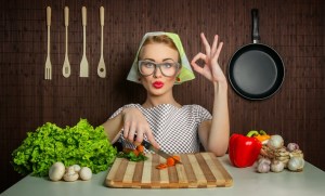 Happy woman cook with okay sign cut carrot-vintage concept
