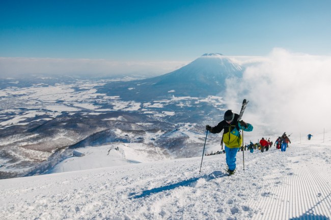Hiking to the peak in Hirafu with Mount Yotei behind
